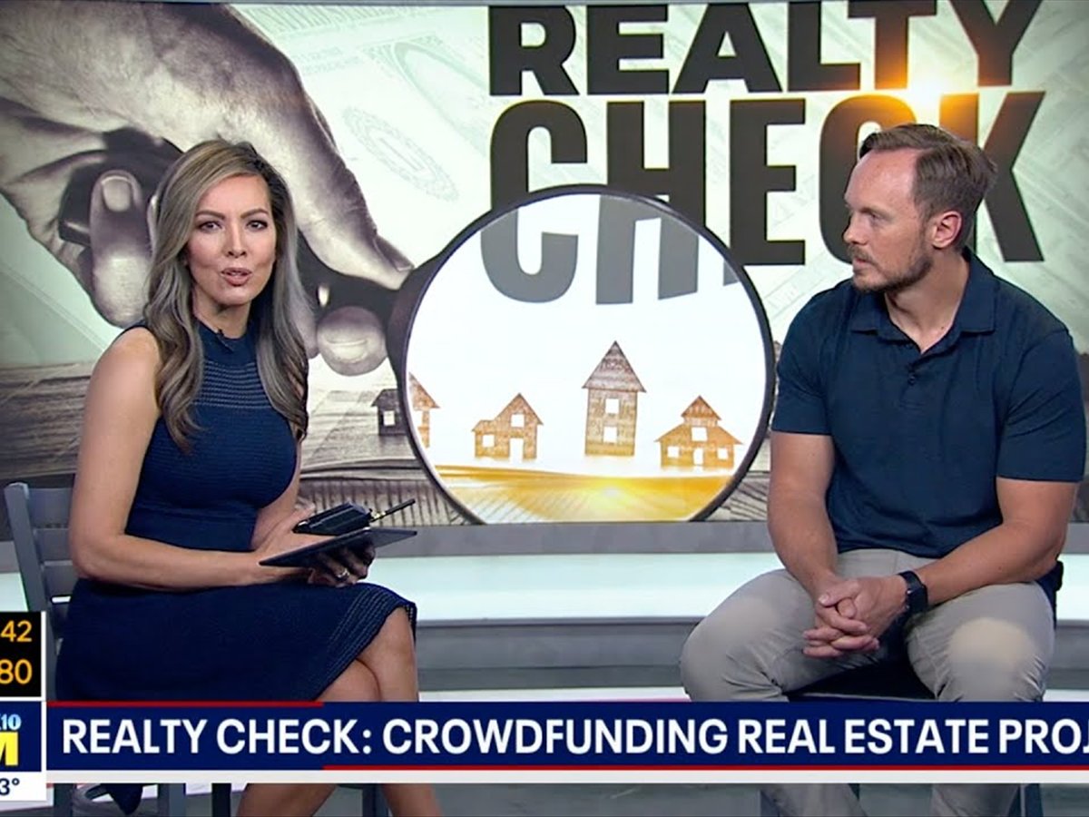 A FOX 10 Phoenix anchor interviewing a Neighborhood Ventures founder in studio during a Realty Check segment on crowdfunded real estate